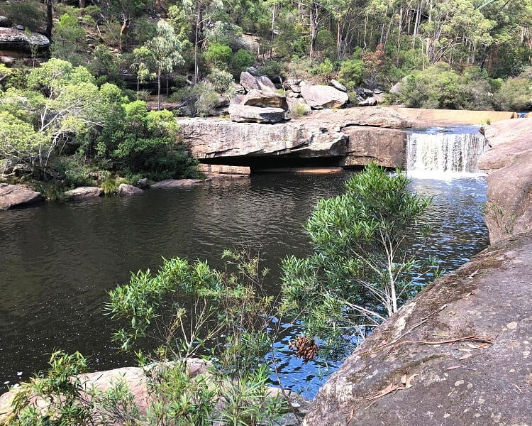 Waterfall flowing into Jingga Pool